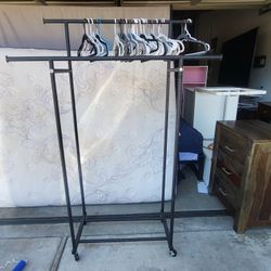 Portable Clothes Hanger w/wheels plus Hangers