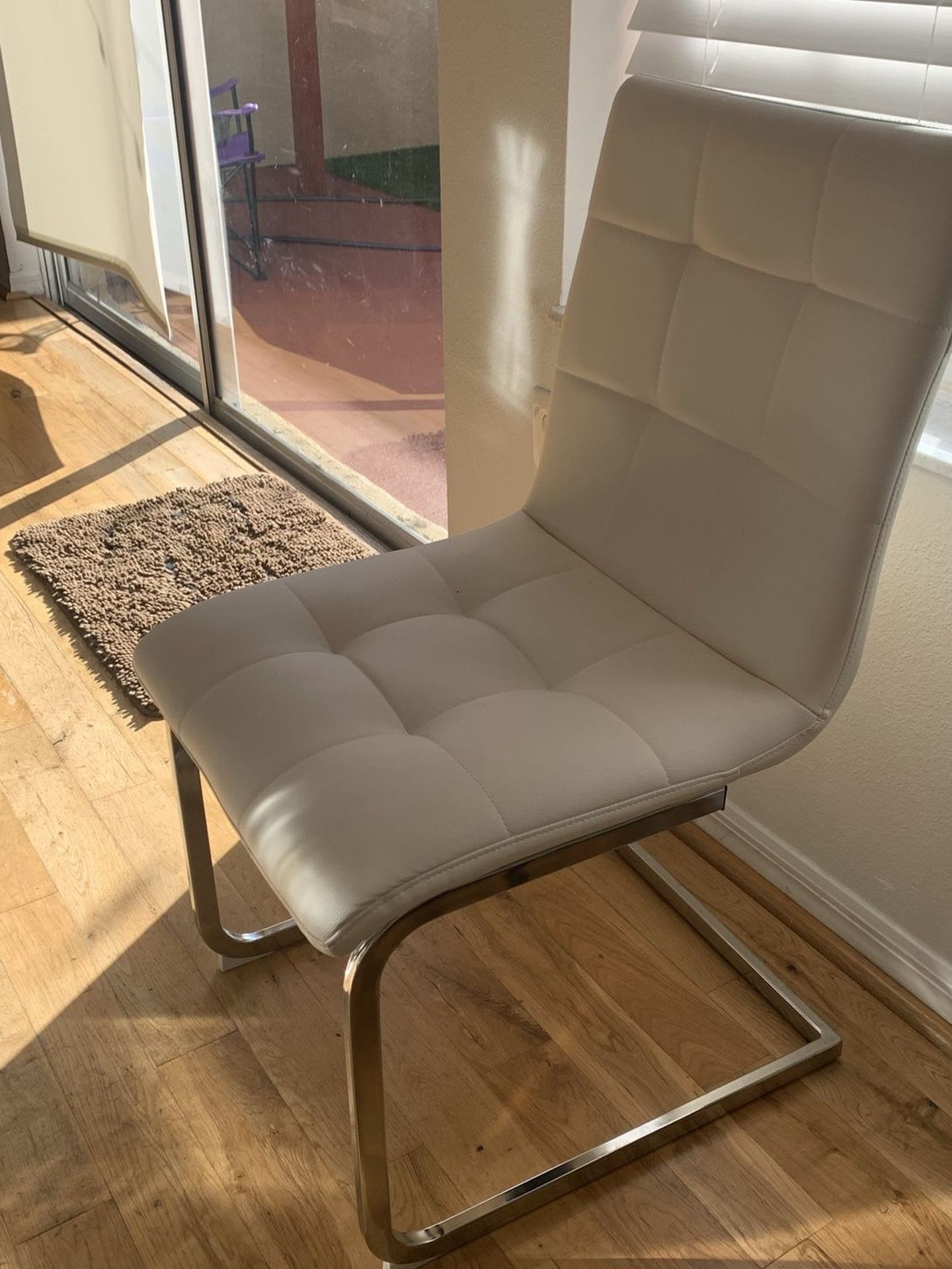 4 White Leather dining room chairs in great condition