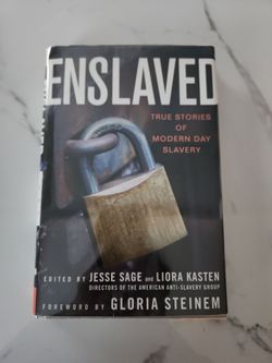 Enslaved book-signed by Gloria Steinum