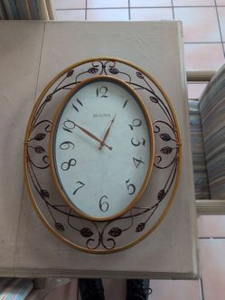 Bulova Oval Wall Clock with Decorative Metal Frame