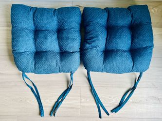 Set of two (two sided) dining cushions, like new