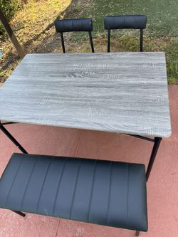 Table W/2 chairs and bench