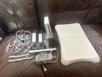 Nintendo Wii w/censor, multiple controllers, multiple nun chuck controllers & 24 games.