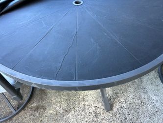 Outdoor patio table 48” and 2 swivel chairs. Excellent Condition. Kept under cover. 2 additional chairs available for an additional $200