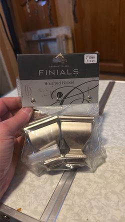 Brushed nickel curtain rod end