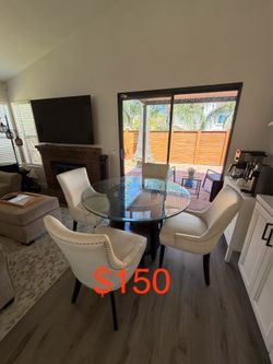 Round Glass Dining Table with 4 White Chairs