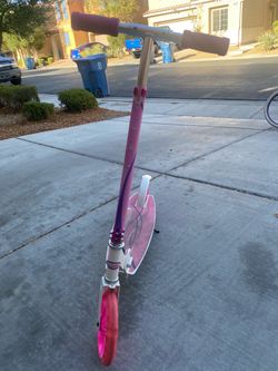 White and pink child scoote