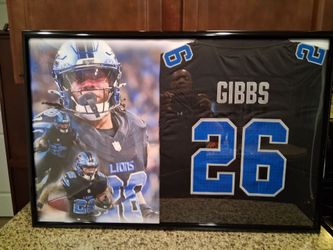 JAHMYR GIBBS DETROIT LIONS STITCHED BRANDED,AUTHENTIC FRAMEDJERSEY.