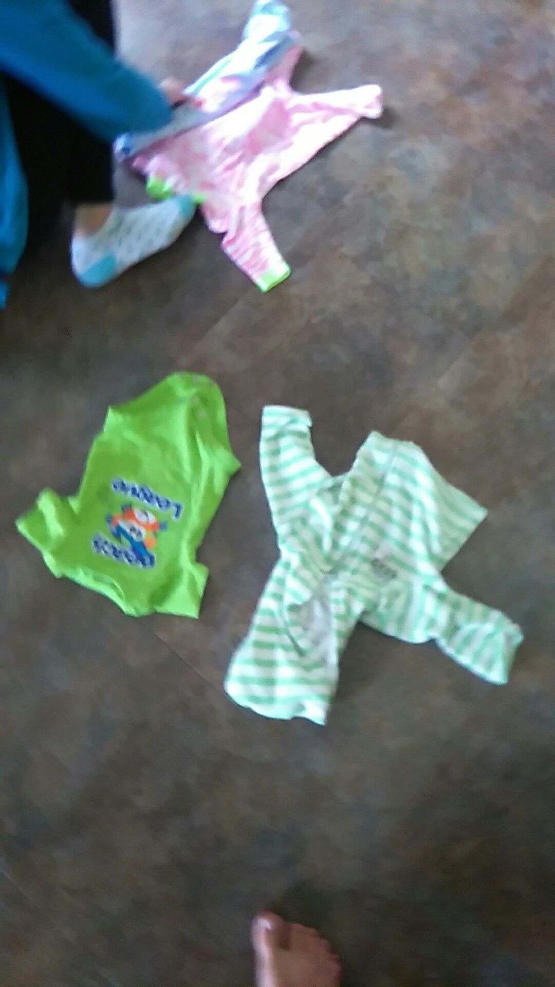 Photo Newborn baby clothes are green and white stripes and the other ones a crab that has Beach leaking Fun in the Sun
