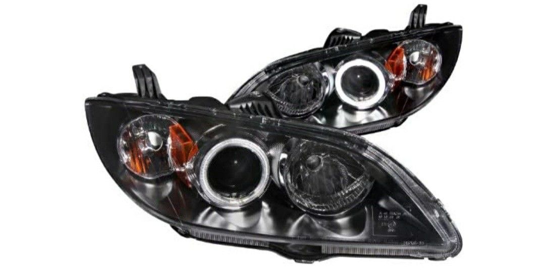 Brand new never used in original packaging. Mazda 3 CCFL HALO BLACK HOUSING PROJECTOR HEADLIGHTS