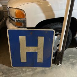 Hospital street sign “H”