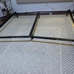 Adjustable bed base with wheels
