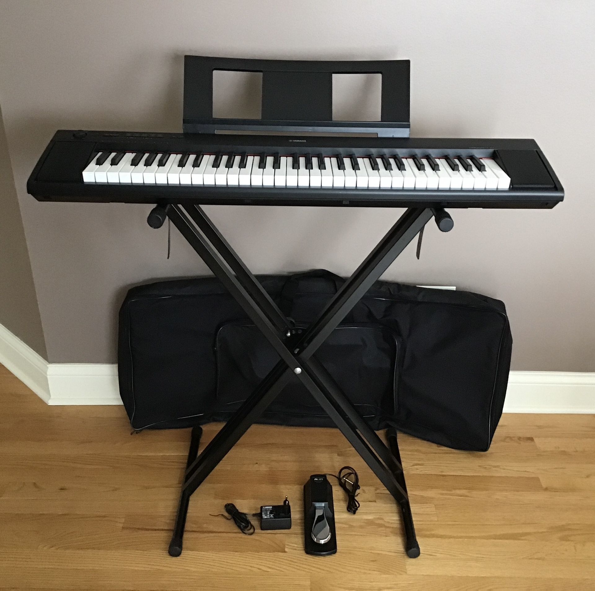 Yahama Piaggero NP-12 Keyboard Digital Piano 61-Key Black + Stand ,Sheet Music stand ,Foot Pedal, Adapter and Bag)