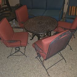 $300  IRON PATIO SET 4 ROCKING CHAIRS AND TABLE 