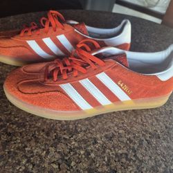 Adidas Gazelle Indoor sneakers in an orange colorway. Size 11