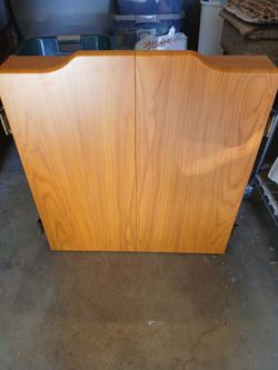 DART BOARD AND DARTS AND CABINET