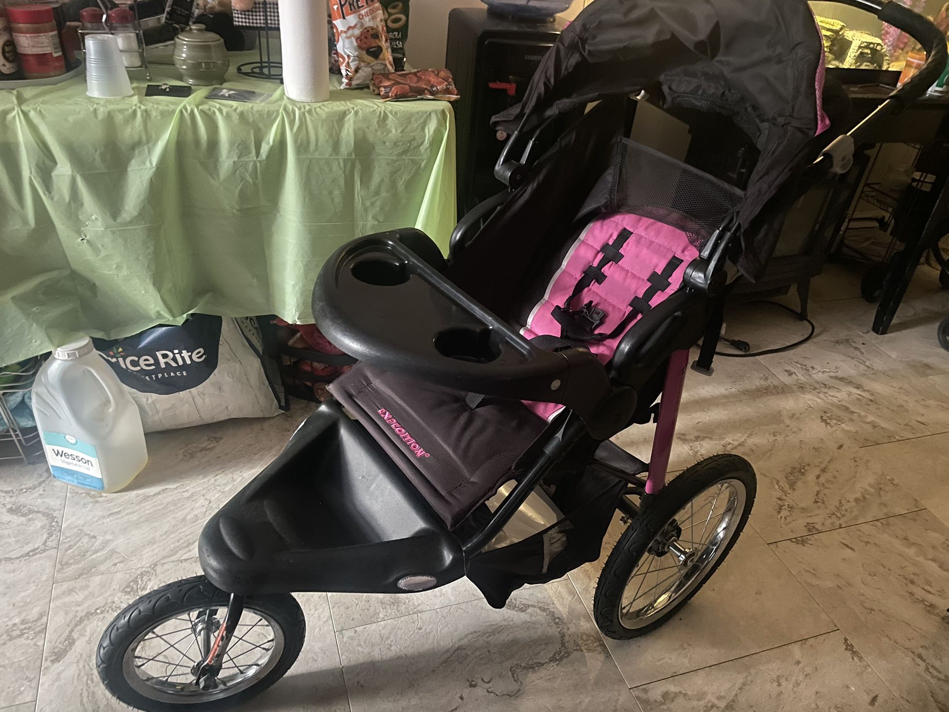 Pink And Black 3 Wheel Baby Carriage