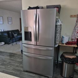 Refrigerator Stainless Steel 4 Door. French Door With Ice And Water Dispenser