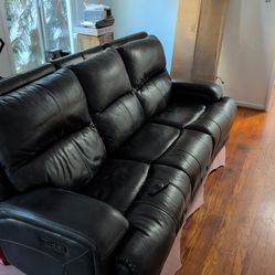 Reclinable leather seats up to four people couch