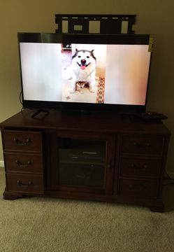 Cherry oak entertainment center and corner shelf it can fit a 60 inch Tv