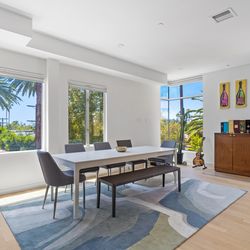 White extending dining table and 4 chairs