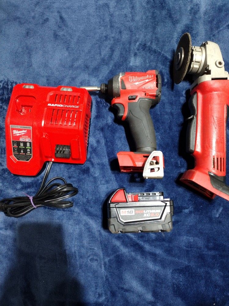 Milwaukee Quarter Inch Impact And Grinder With Battery Charger And Battery