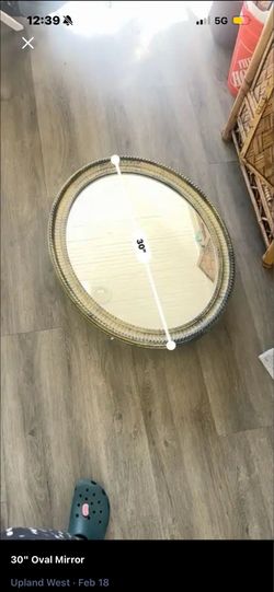 30” oval mirror with medicine cabinet