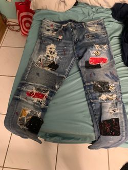 Embellish patched fitted jeans
