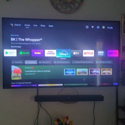 TV and Leather Sectional with Ottoman 