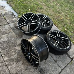 4 rims for sale 2 with tires on them