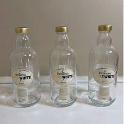empty bottles of pure white Hennessy