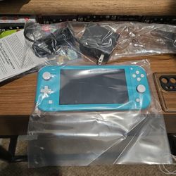 Brand NEW NINTENDO SWITCH LITE TURQUOISE COLOR WITH NEW CHARGER And PAMPLET! 