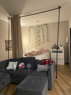Room divider with curtains