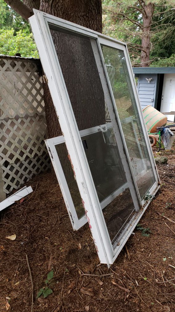 Sliding glass door, 6 feet (72")wide ,80 in high. White . opens from right to left from inside.. slight water damage. was left out side accidentally