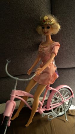 Doll on bike
