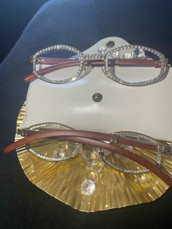 One (1) Millionaire Celebrity Italian Unisex wooden frame with sparkling lab, diamond ice trim. Comes with a white protective case for secure storage.