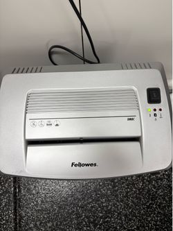 This is a Fellowes DM8C cross-cut paper shredder designed for home office use