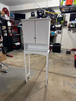 Toilet storage cabinet