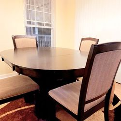 Elegant Extendable Oval Solid Espresso Wood  Dining Table with Storage, Accompanied by 4 Stain Resistant Chairs.