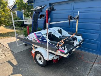 (2) Js300 jet skis and trailer