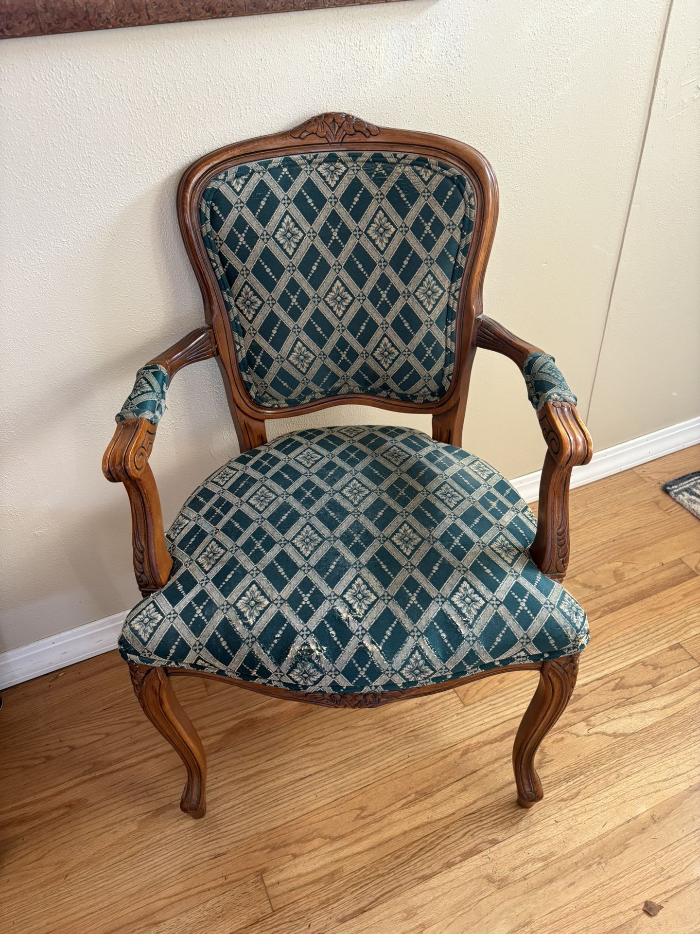 Louis XV style cabriolet armchair with a concave back and overstuffed seat cushion