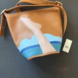 Coach crossbody featuring a unique beach-inspired artistic design