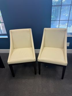 White faux leather office chairs