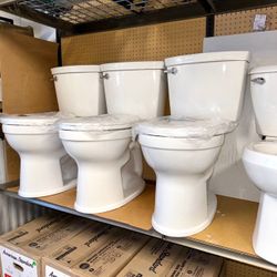 American Standard Champion Two-Piece 1.28 GPF Single Flush Elongated Chair Height Toilet with Slow-Close Seat in White