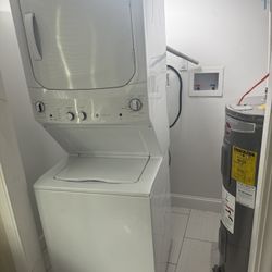 GE Stacked Laundry Center with 3.8-cu ft Top load Washer and Electric 5.9-cu ft Dryer