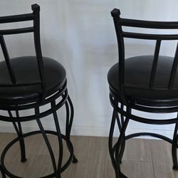 2 BLACK SWIVEL BAR STOOLS