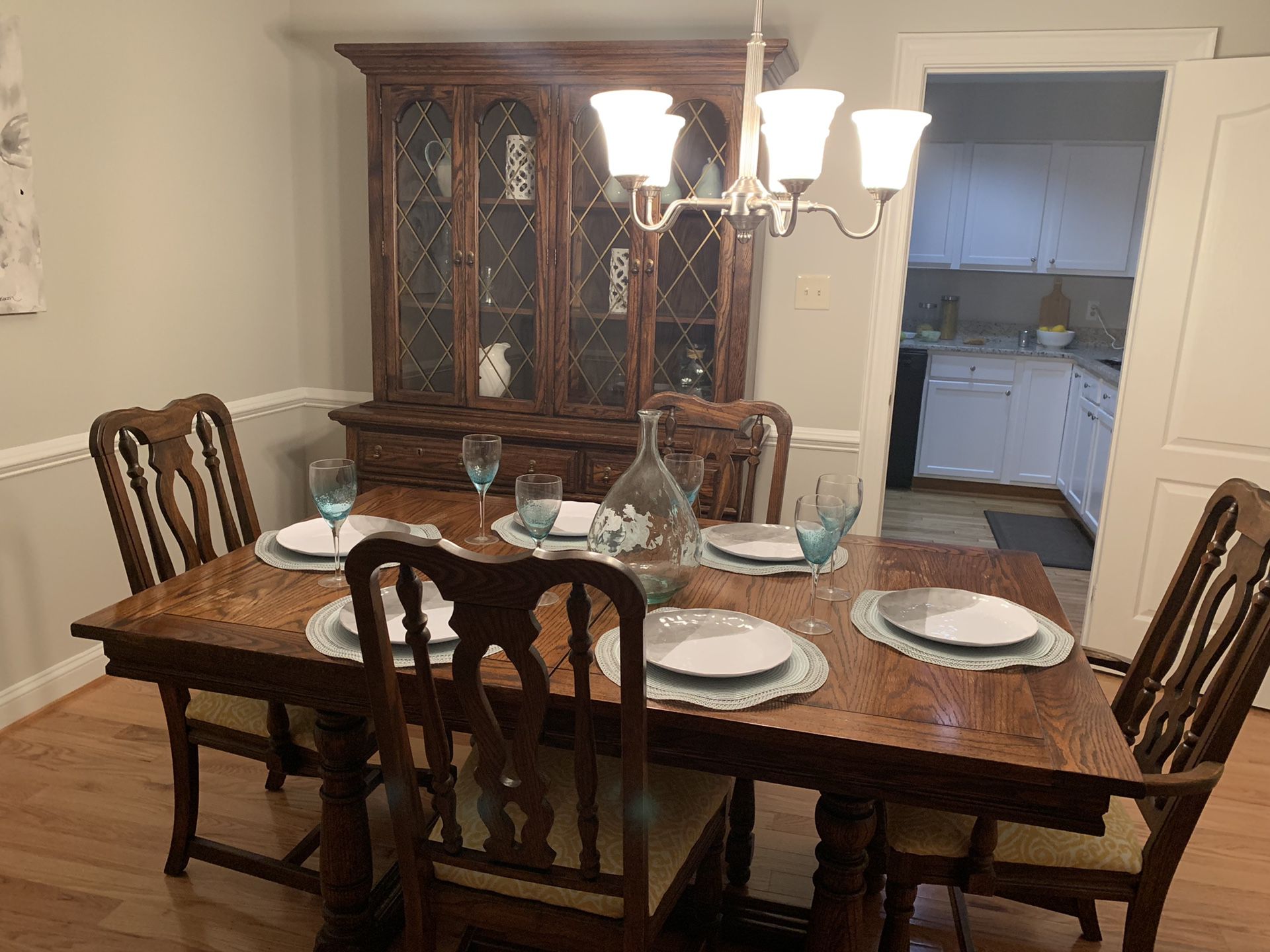 Formal dining table with 6 chairs and a leaf