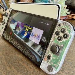 Nintendo Switch OLED Bundle – 4 Joy-Cons (And Two 1+1 Joy-Con Controller Grips), 3 Games, 2 Cases, & a 256GB SD