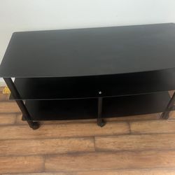Black TV stand with 2 shelves 