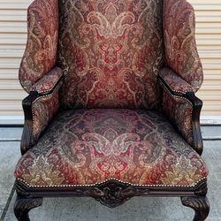 Upholstered wingback armchair with paisley chenille fabric, carved wood frame by Isenhour Furniture
